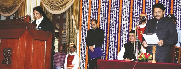 Maharashtra Governor C Vidyasagar Rao administers the oath of office to chief justice of the Calcutta High Court Justice Dr Manjula Chellur as the chief justice of the Mumbai High Court in Mumbai as Maharashtra Chief Minister Devendra Fadnavis looks on.