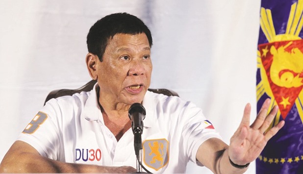 Duterte speaks during a news conference in Davao city.