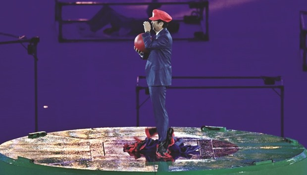 Japanese Prime Minister Shinzo Abe, dressed as Super Mario, appears during the closing ceremony. (AFP)
