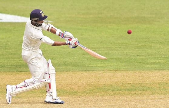 Indiau2019s Ajinkya Rahane connects for a six off a delivery from West Indies bowler Roston Chase on day three of their second Test match on Tuesday at Sabina Park in Kingston, Jamaica.