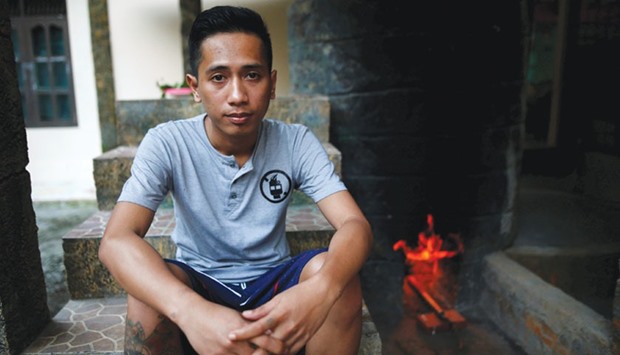 Recovering drug addict Rizki Mulyadi waits while a herbal bath is being prepared at a traditional rehabilitation centre in Purbalingga.