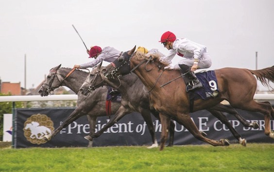 Qatari jockey Faleh Bughenaim (left) rides Al Shaqabu2019s Al Mahdod to victory in the President Of The UAE Cup (Gr3 PA) in Belgium.