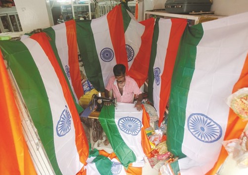 A worker stitches national flags at a workshop ahead of Indiau2019s Independence Day celebrations in Agartala.