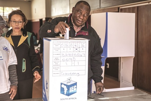 South African deputy president and South African ruling party ANC deputy president Cyril Ramaphosa casts his ballot as a special vote on the eve of South Africa highly contested municipal elections yesterday in Johannesburg.