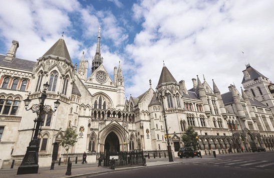 The front entrance to The Royal Courts of Justice is pictured on The Strand in central London. The Royal Court of Justice building accommodates both the court of appeal and the high court. Often referred to as the law courts, the building was designed by architect George Edmund Street in Gothic style and opened by Queen Victoria in 1882.