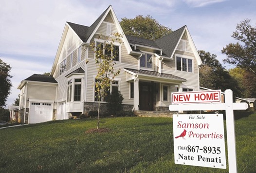 A real estate signboard advertising a new home for sale is seen in Vienna, Virginia. The Commerce Department said yesterday new home sales surged 12.4% to a seasonally adjusted annual rate of 654,000 units last month, the highest level since October 2007.