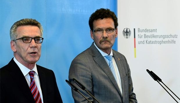 German Interior Minister Thomas de Maiziere (left) and President of the Federal Office of Civil Protection and Disaster Assistance (BBK) Christoph Unger hold a joint press conference in Berlin on Wednesday.