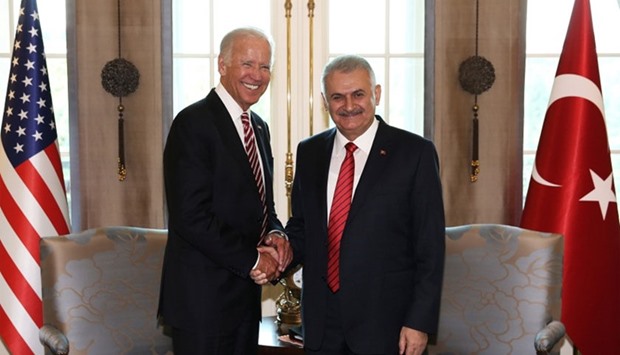 Turkish Prime Minister Binali Yildirim (R) meets with US Vice President Joe Biden in Ankara, Turkey