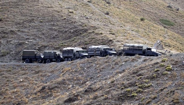 Algerian military vehicles are seen on a mountain near the village of Ait Ouabane, where Hervu00e9 Gourdel was kidnapped by militants on Sunday, southeast of Algiers September 23, 2014.  Reuters
