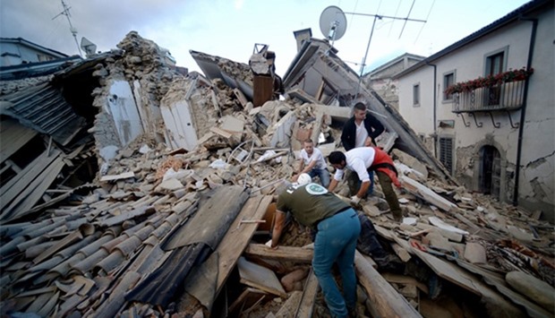 Resident search for victims in the rubble after a strong heartquake hit Amatrice, Italy