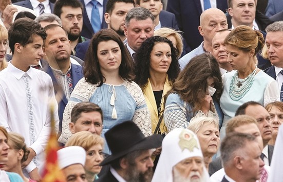 Ukraineu2019s President Petro Poroshenkou2019s daughter Oleksandra cries (2nd R) as wife Maryna (R), daughter Yevheniya and son Mykhailo look on during the parade in Kiev.