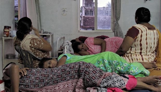Surrogate mothers in various stages of pregnancy rest in a dormitory above a clinic in Anand in Gujarat state in this file picture.