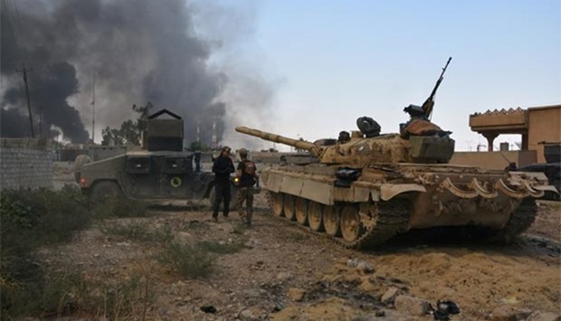 A tank of the Iraqi army is seen in the town of Qayyara.