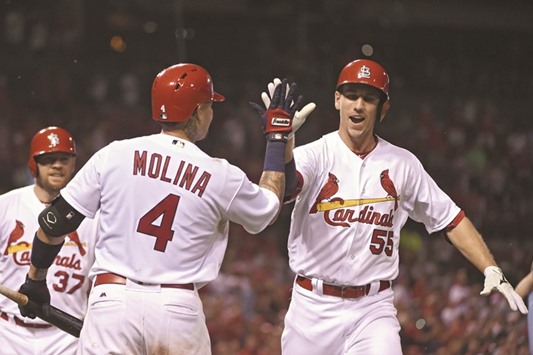 St. Louis Cardinalsu2019 Stephen Piscotty (right) celebrates with catcher Yadier Molina after hitting a two-run home run off of New York Mets starting pitcher Jacob deGrom (not pictured) during their game in St. Louis, Missouri, on Wednesday. (USA TODAY Sports)