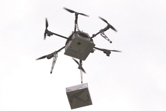 The pizza delivery drone with a pizza box on a test flight in Auckland.