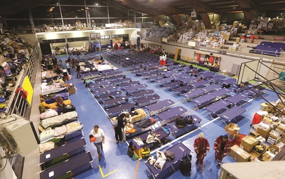 People is seen preparing to spend the night in a gym following the earthquake in Amatrice.