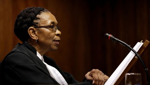 Judge Thokozile Masipa reads her verdict during an appeal hearing brought by prosecutors against the six-year jail term handed to Oscar Pistorius.