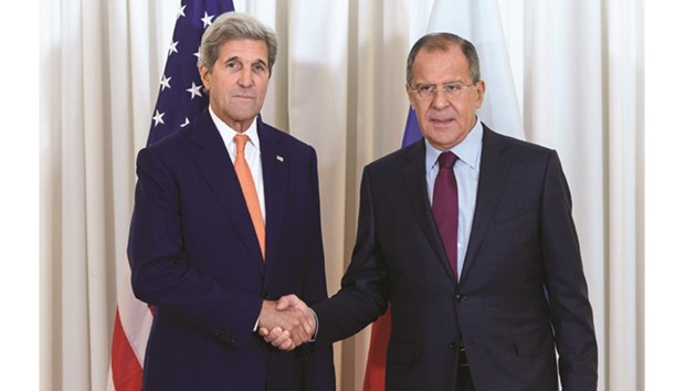 US Secretary of State John Kerry and Russian Foreign Minister Sergei Lavrov shake hands during a meeting  on the Syrian crisis in Geneva.