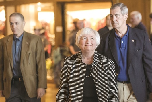 Janet Yellen, chair of the US Federal Reserve (centre), arrives for a welcome dinner during the Jackson Hole economic symposium in Moran, Wyoming, on Thursday. In her address, Yellen took note of strong job growth, saying gradual increases in the Fedu2019s benchmark rate in the coming years should be expected.