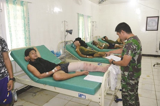Soldiers wounded in an encounter with members of militant group Abu Sayyaf, receive treatment at a military hospital in Jolo town.