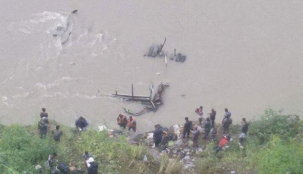 Search and rescue operation goes on for the passengers of the bus that plunged into Trishuli River at Chandi Bhanjyang village in Chitwan district.  Picture courtesy: Himalayan Times