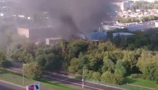 The image grab from a video posted in social media that shows smoke rising from the warehouse.