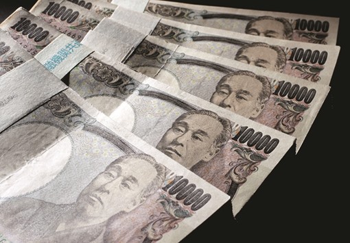 10,000 yen banknotes spread out at an office of World Currency Shop in Tokyo. Asian currency markets are expected to be volatile over the next three months after Janet Yellen on Friday signalled another interest rate rise.