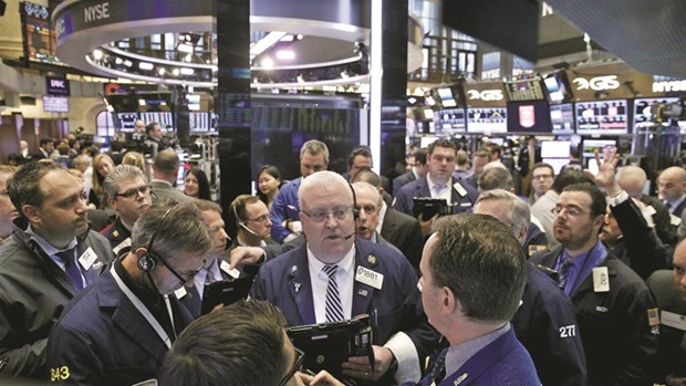 Traders work on the floor of the New York Stock Exchange. The S&P 500 Index fell 0.7% to 2,169.04 last week, the biggest drop since June, to erase its August gains.