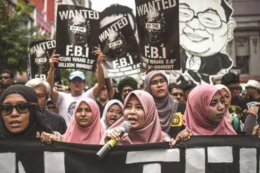 Student activists march during a protest over a financial scandal involving state fund, 1MDB, in Kuala Lumpur yesterday.