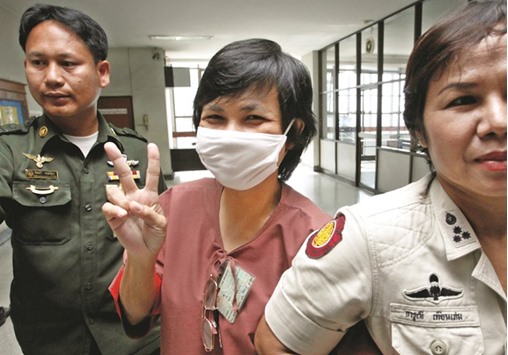 File photo shows Daranee Charnchoengsilapakul, a supporter of ousted premier Thaksin  Shinawatra, leaving a courtroom in Bangkok.
