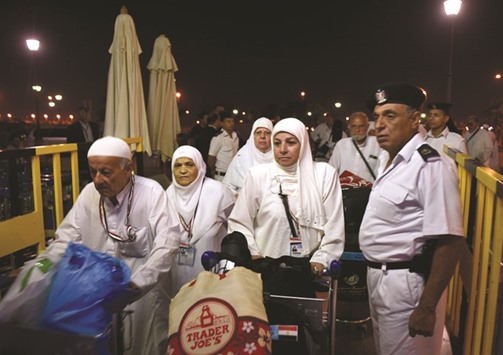 Egyptian pilgrims arrive at the Cairo International Airport for their departure to the annual Haj pilgrimage in the holy city of Makkah.