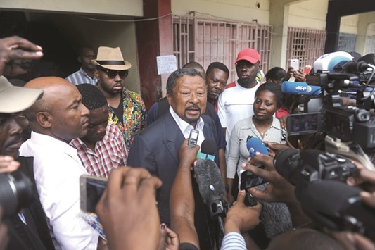 Ping speaks with journalists at the Martine Oulabou school in Libreville.