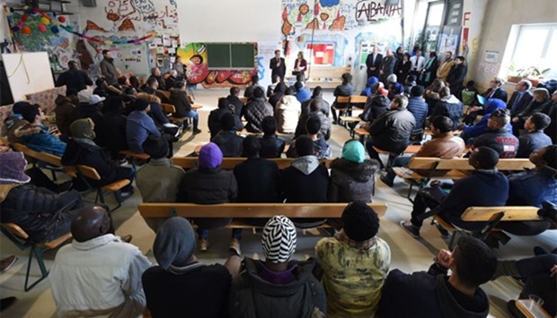 Migrants following lessons for refugees and asylum seekers on German legislation