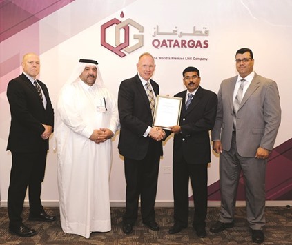 Qatargas officials receiving the ISO 28000 certification.