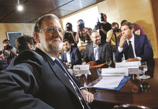 Rajoy and Ciudadanos leader Albert Rivera (right) at their meeting yesterday in parliament in Madrid.