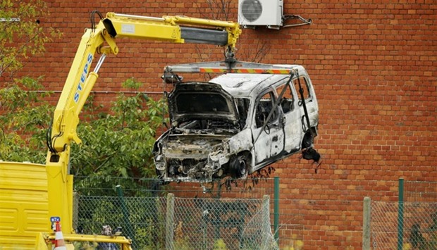The burnt car used to ram raid the National Institute for Criminalistics and Criminology is getting removed.