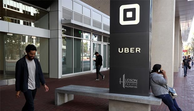 The logo of the ride-sharing service Uber is seen in front of its headquarters in San Francisco.