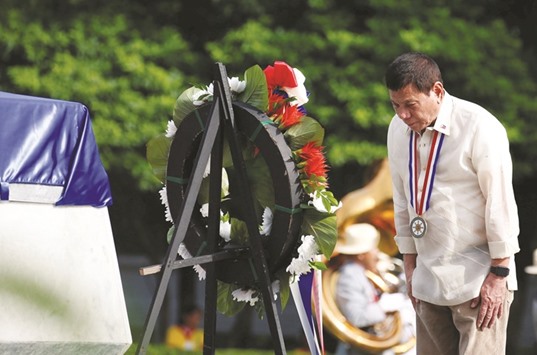 Philippine President Rodrigo Duterte pays his respect as he lays a wreath during National Heroes Day commemoration at the Libingan ng mga Bayani (Heroesu2019 Cemetery) at Taguig city, Metro Manila in the Philippines yesterday.