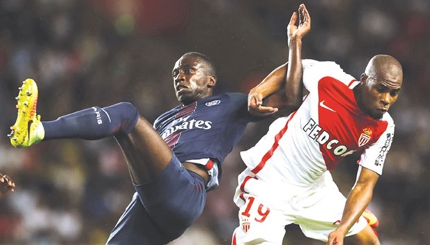 Monaco defender Djibril Sidibe (R) vies with Paris Saint-Germain midfielder Blaise Matuidi during their Ligue 1 match.