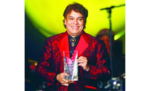 A November 9, 2009, file photo of Mexican singer Juan Gabriel accepting the 2009 Latin Recording Academy Person of the Year award during u2018De Fiesta With Juan Gabrielu2019 in Las Vegas.