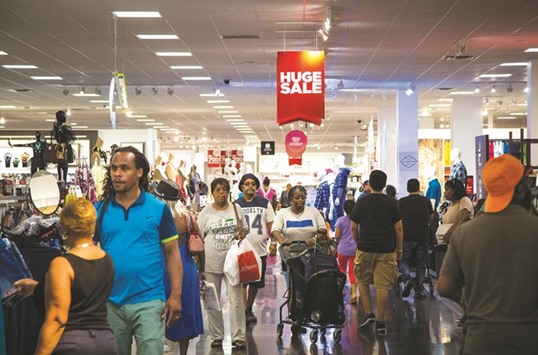 Customers shop at a JC Penney store at the Gateway Shopping Center in the Brooklyn borough of New York. The 0.3% rise in consumer spending in the US matched forecasts and followed a 0.5% increase the prior month that was revised up, a Commerce Department report showed in Washington yesterday.