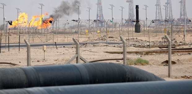 A picture taken on Saturday of gas flare burning in the Zubair-1 storage zone of the Zubair oil field, located around 20km southwest of Basra in southern Iraq. Iraq, Opecu2019s second-largest producer after Saudi Arabia, depends on oil sales for 95% of its public income. Its economy is reeling under the double impact of low oil prices and the war against Islamic State militants.