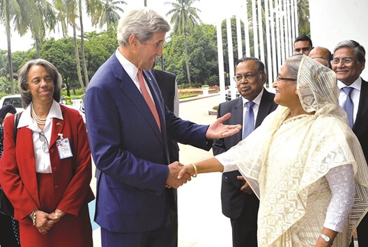 US Secretary of State John Kerry and Bangladesh Prime Minister Sheikh Hasina shake hands ahead of a meeting in Dhaka yesterday.