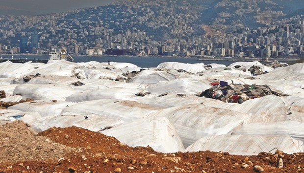 Garbage is piled prior to placement in the Bourj Hammoud dump site, north-east of the capital Beirut, yesterday.