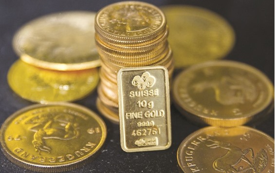 Gold bullion is displayed at Hatton Garden Metals precious metal dealers in London. Central banks cut their gold purchases by 40% during the three months through June, compared with the same period a year earlier, to the lowest since 2011, World Gold Council figures compiled by Bloomberg show.