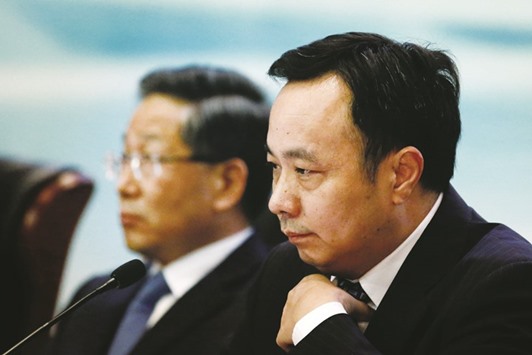 President of Agricultural Bank of China, Zhao Huan (right), attends a news conference in Beijing. Four of Chinau2019s so-called u2018Big Fiveu2019 state-owned banks, including Agricultural Bank of China, have warned that profits will continue to be pressured in the second half of the year, as slowing growth in the worldu2019s second-biggest economy hits borrowers and saps lendersu2019 margins.