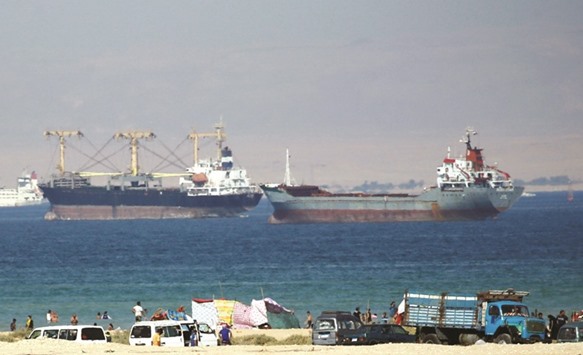Container ships crossing the Gulf of Suez towards the Red Sea before entering the Suez Canal north of Cairo. Receipts from the Suez Canal have been hit by the slowdown in global growth and international trade
