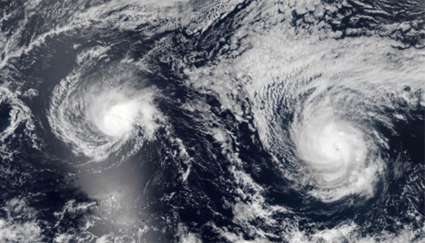 NASA satellite image shows Hurricanes Lester(R) (13E) and Madeline (14E) in the Pacific Ocean