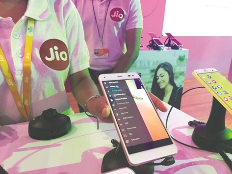 A Reliance employee demonstrates Jio LYF phone at their headquarters on the outskirts of Mumbai. The ambitious Jio project could make Reliance the most comprehensive provider of telecom and Internet services across India u2013 and give it unprecedented access to the countryu2019s untapped u2018big datau2019: how millions eat, shop and have fun.