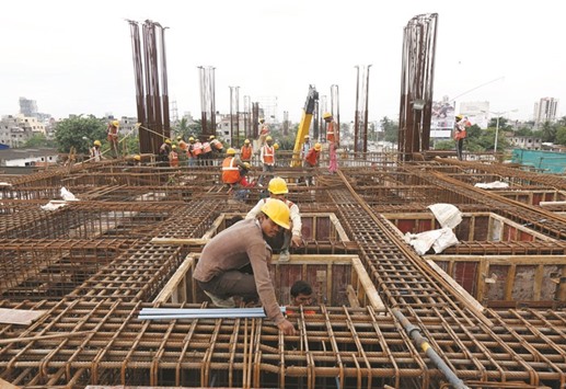 Labourers work at the construction site of a metro rail station in Kolkata. Indiau2019s gross domestic product expanded 7.1% year-on-year in the three months from April-June, down from the stellar growth of 7.9% in the preceding quarter, according to the statistics ministry.